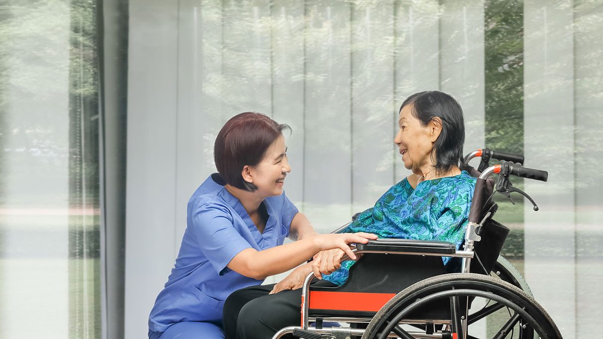 A caregiver and resident enjoying fresh air