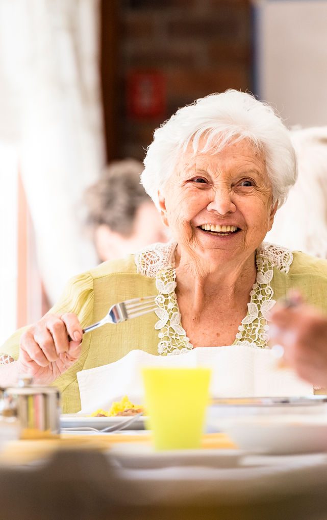 A smiling resident at Minneola Place