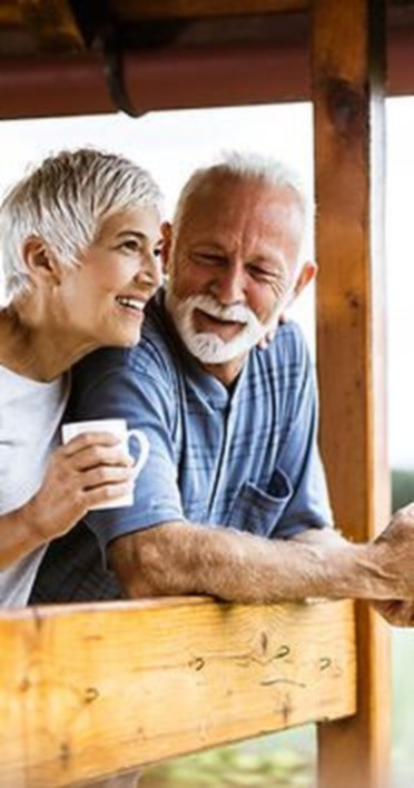 Residents enjoying coffee together on the terrace at Minneola Place